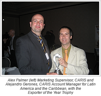 Alex Palmer (left) Marketing Supervisor, CARIS and Alejandro Gerones, CARIS Account Manager for Latin America and the Caribbean, with the Exporter of the Year Trophy