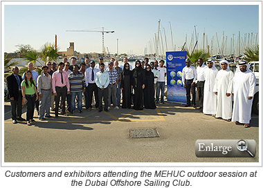 Customers and exhibitors attending the MEHUC outdoor session at the Dubai Offshore Sailing Club.